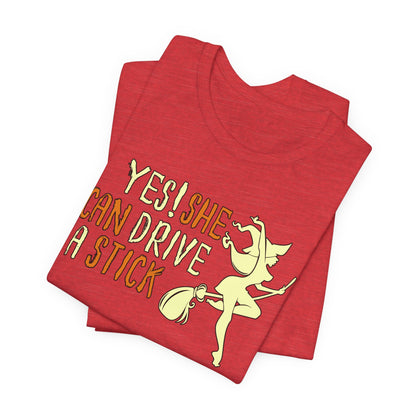 "Yes! She Can Drive A Stick" Tee | Hilarious Halloween Themed Graphic T-Shirt