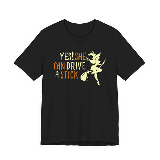 "Yes! She Can Drive A Stick" Tee | Hilarious Halloween Themed Graphic T-Shirt